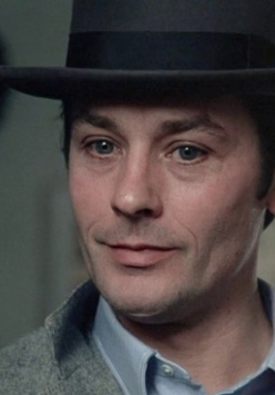 Photo of a man in a bowler hat.