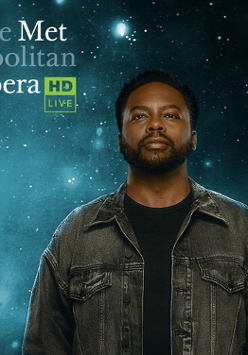 The poster shows a tall man dressed in black T-shirt and a grey denim jacket. Behind him is a starry dark background.