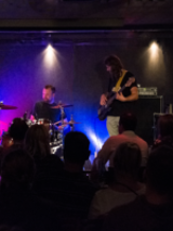 Photo of the band performing on stage