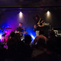 Photo of the band performing on stage