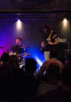 Photo of the band performing on stage