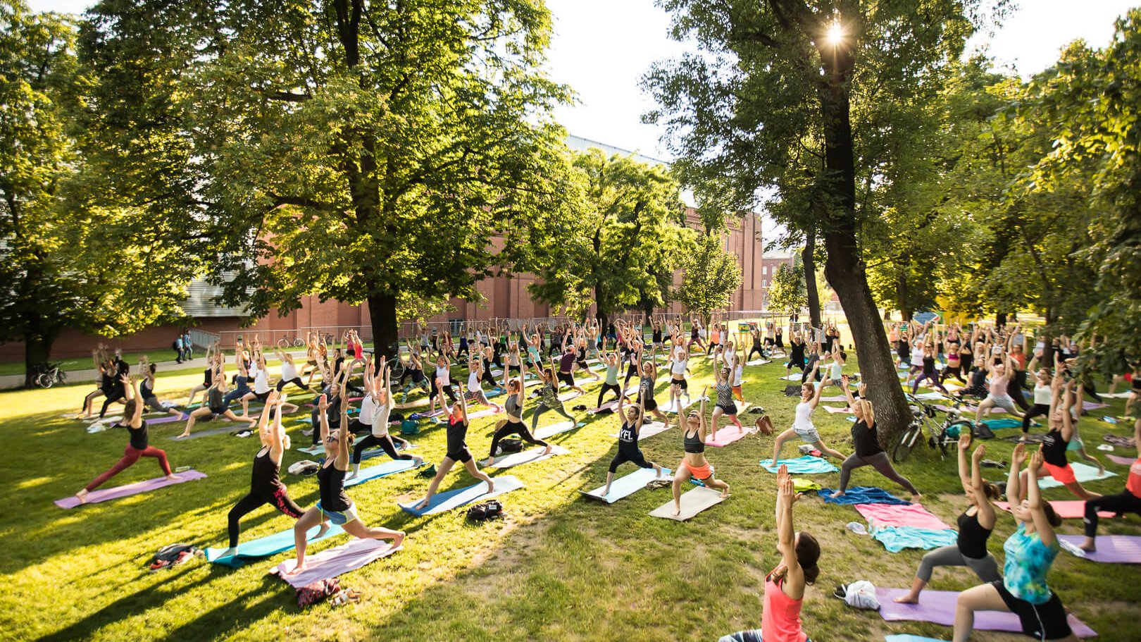 Free outdoor yoga classes in the Stary Browar (Old Brewery) park, photo: Jakub Krzyżanowski