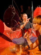 Photo from the spectacle - two women performing on stage