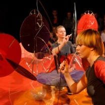 Photo from the spectacle - two women performing on stage