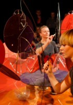Photo from the spectacle - two women performing on stage