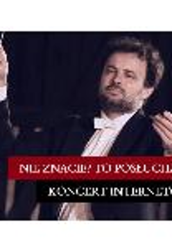 A picture of a conductor holding a baton in his hand