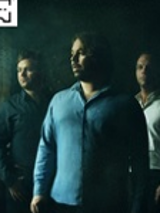 Photo of three members of the band