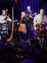 Photo of the band performing on stage