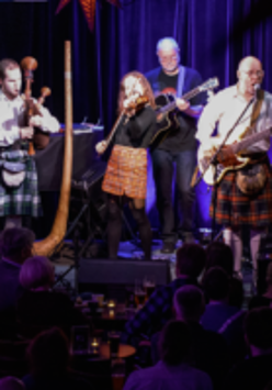 Photo of the band performing on stage
