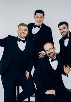 Photo of the band - four men dressed in suits