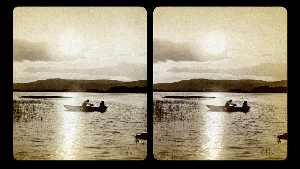 Stereophotograph of a boat with a rowing man on a lake.