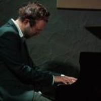 Photo of an artist playing the piano