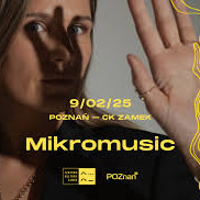 A photo of a face of a woman looking into the camera. Her left hand is raised, and her fingers cast a shadow across her face. This photo is a backdrop for information about the concert written in yellow font.