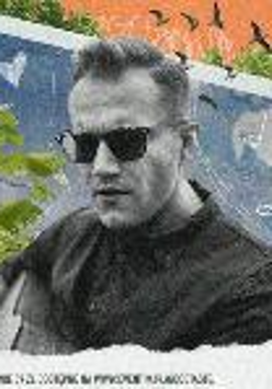 Picture of an artist - face of a man in black sun glasses.
