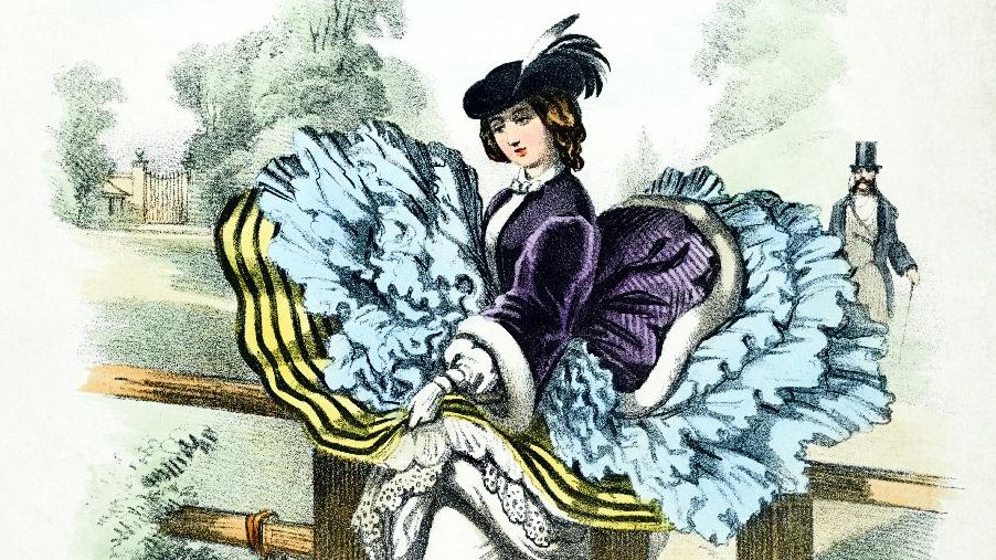 Picture of a woman in a dress and a hat standing by the wooden fence. A part of a dress (skirt) is lifted and shows underwear. Near a woman a small white dog leashed to the fence.