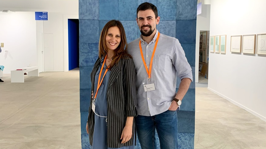 Picture of a young couple on blue background - the owners of the Rodriguez Gallery