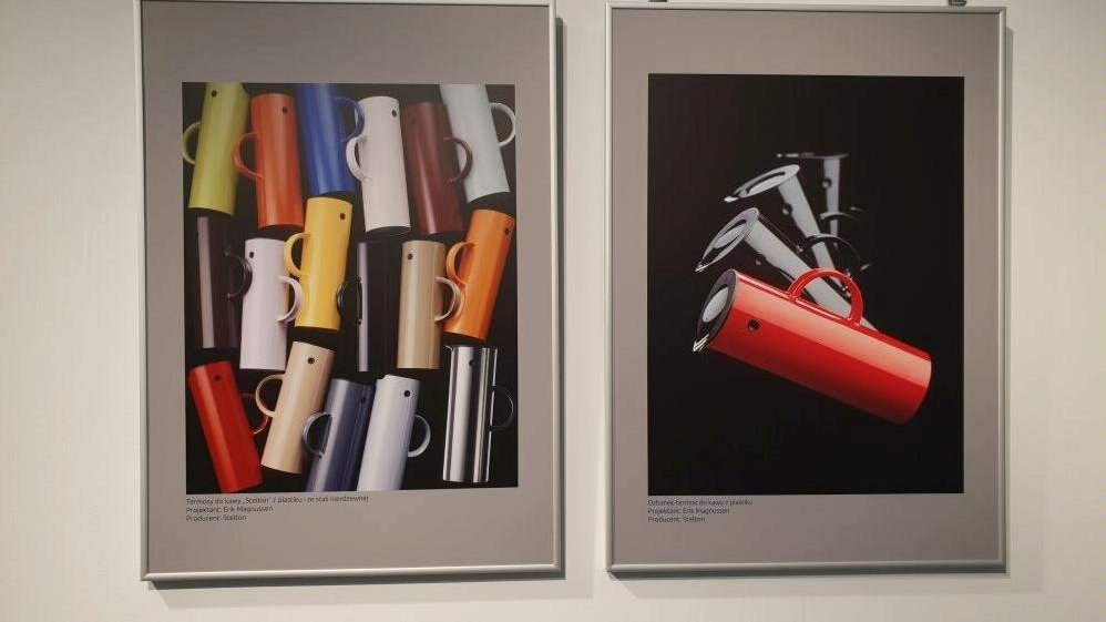 Photo of two pictures hanging on the wall presenting colourful modern mugs.