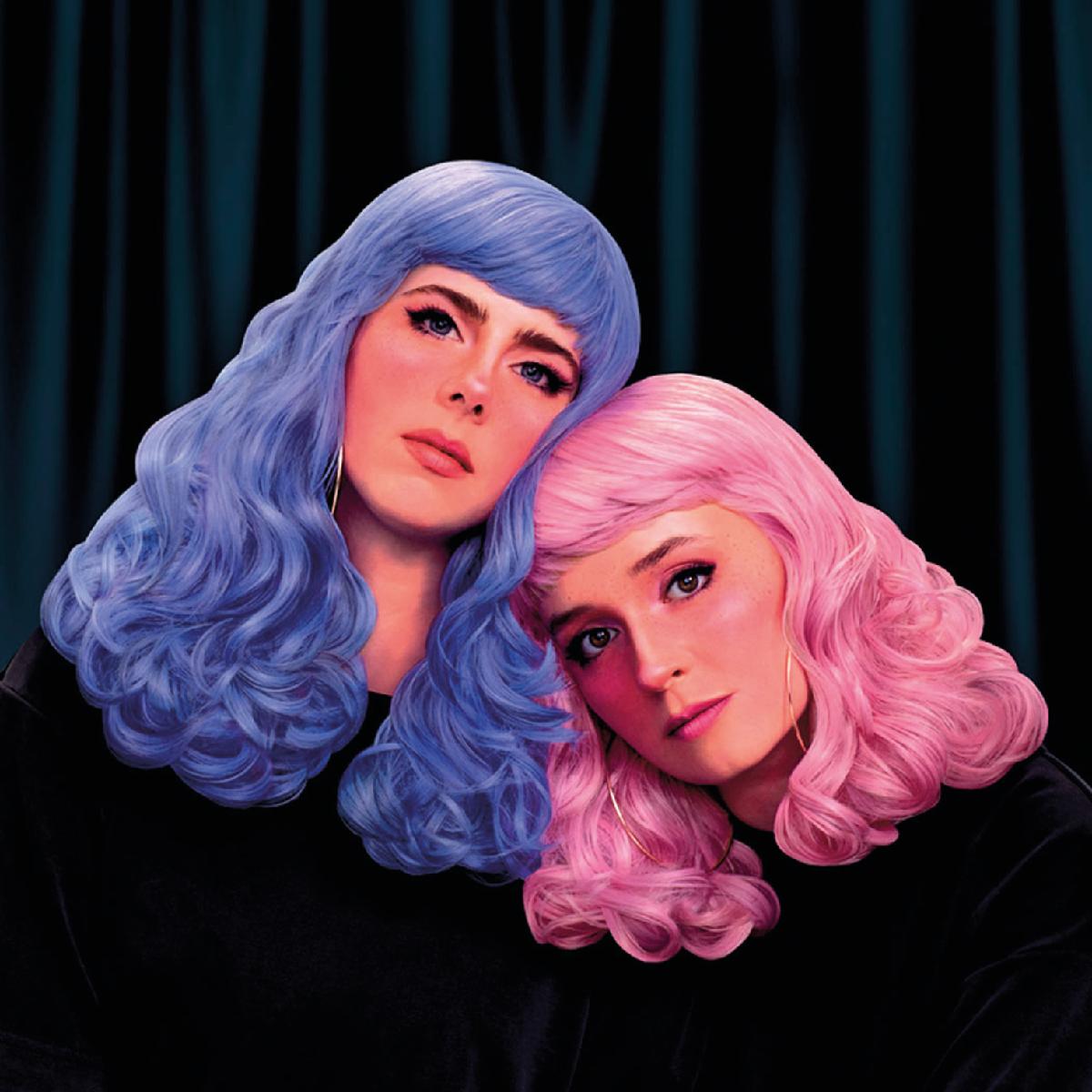 Album cover: two women with long hair - one pink-haired, and another blue-haired - on a dark background. - grafika artykułu