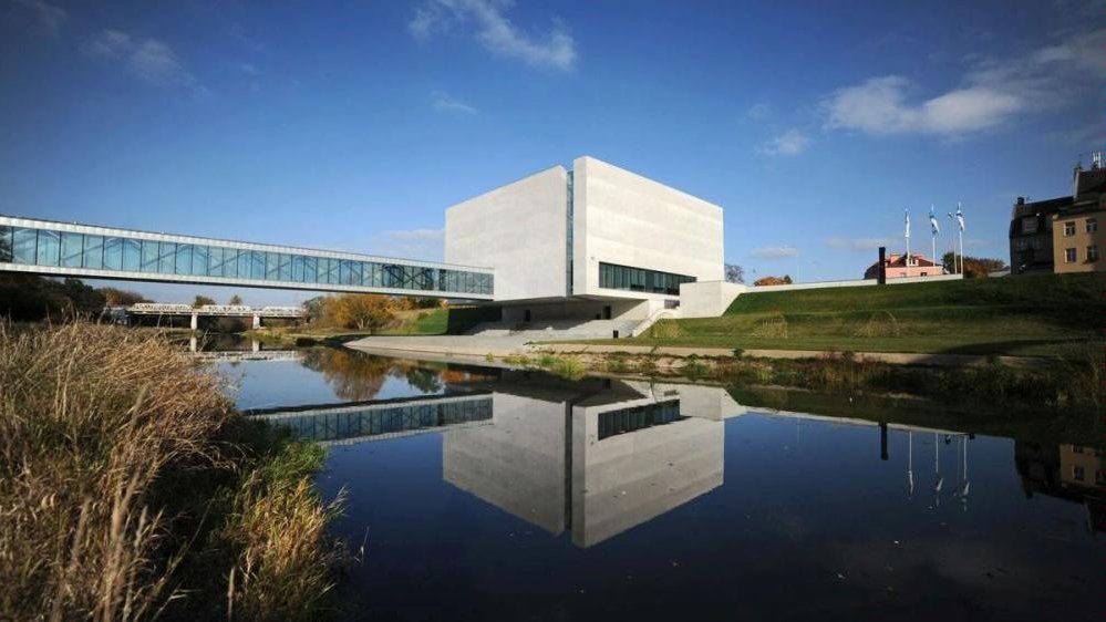 Concrete cube-shaped building by the river