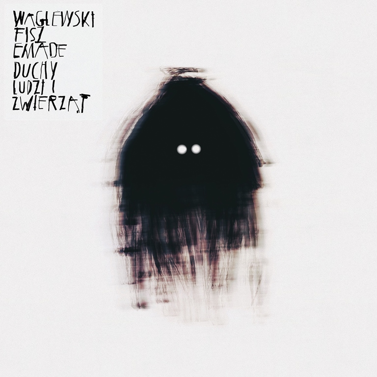 An album cover - black creature looking with white circle eyes on a white background. Black captions in left top corner - grafika artykułu