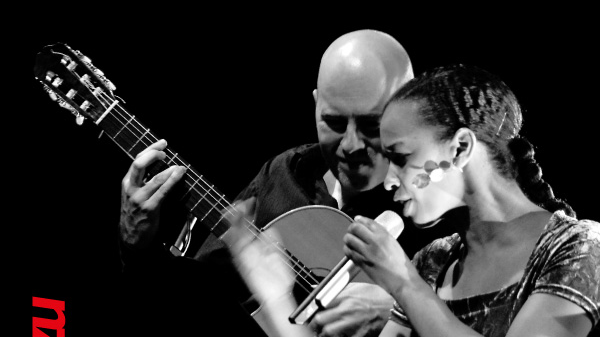 Concert poster - black and white photo of the artists on black background. At the top of the poster - information about the concert.