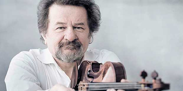 Picture of a violinist - a man holding violin in his hands. - grafika artykułu