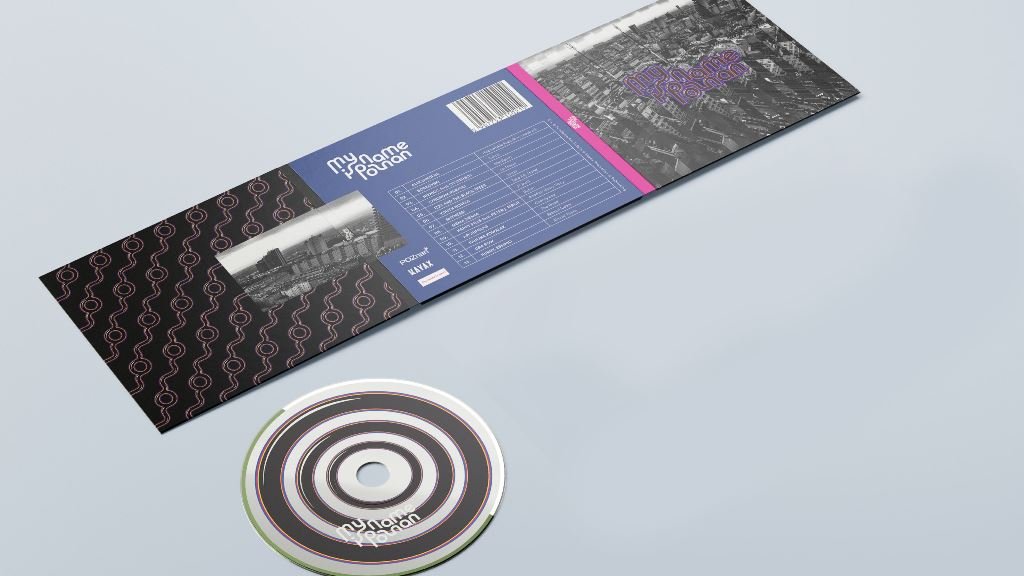 Photo of unfolded album cover and a cd lying next to it