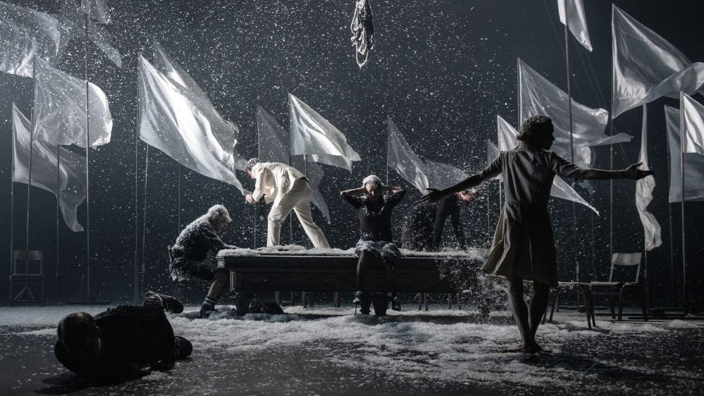 A scene from the performance in blue-grey-white colours