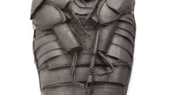 Photo of a sculpture on a white background.