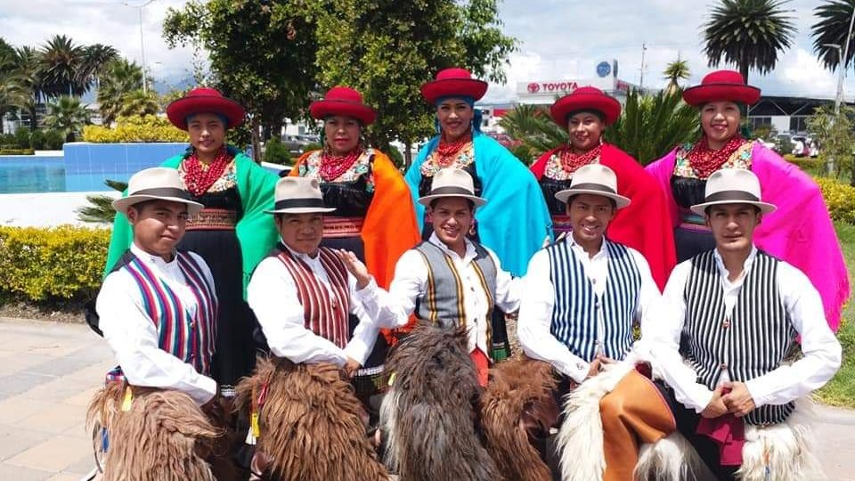 Photo of a group of people from Ecuador dressed in traditional folk costumes.