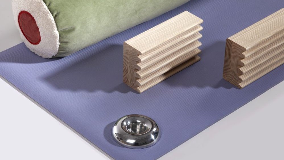 One of the exhibition works - a few objects on a blue mat.