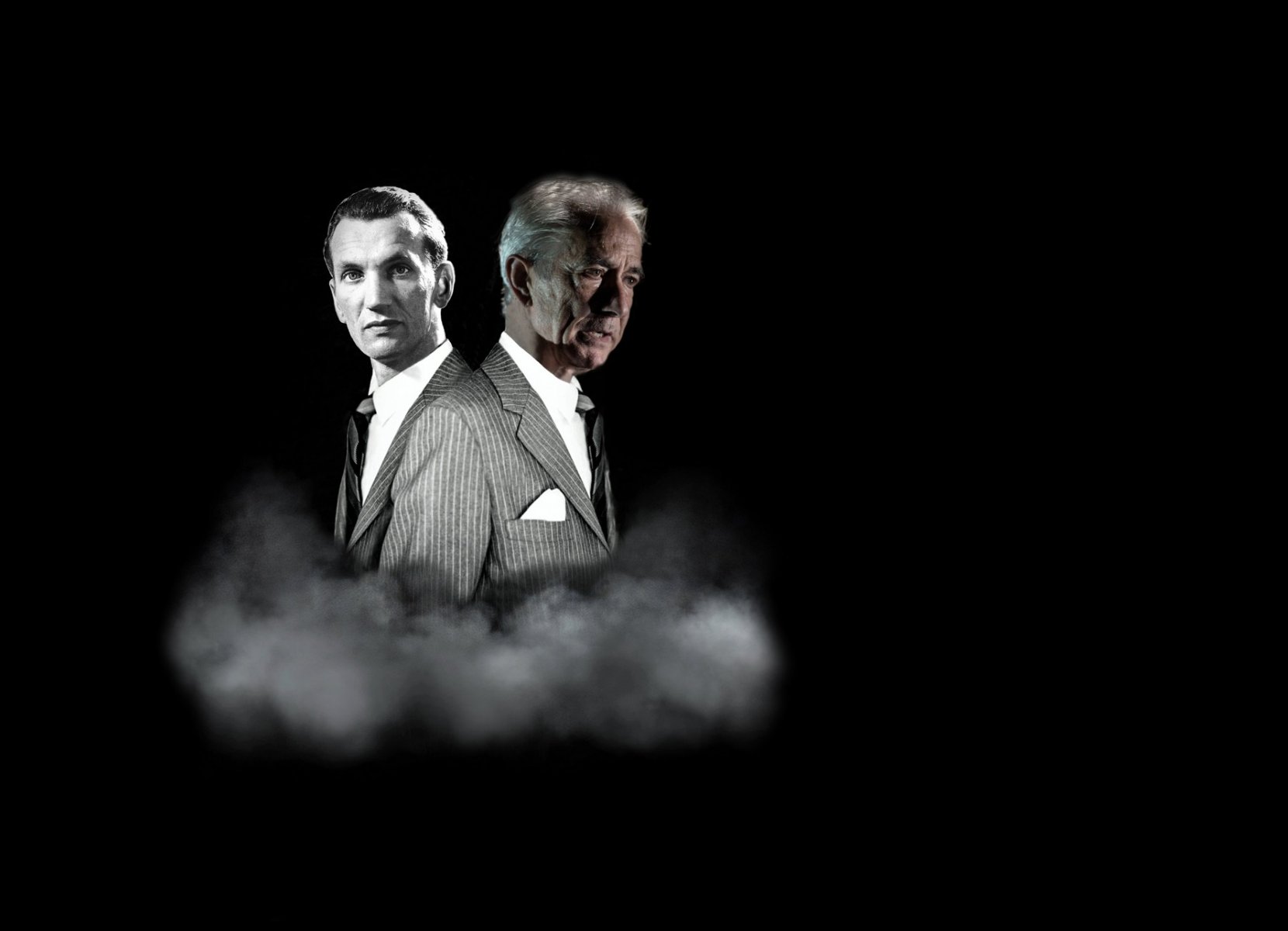 Black and white performance poster - photo of two men in suits on a black background. - grafika artykułu