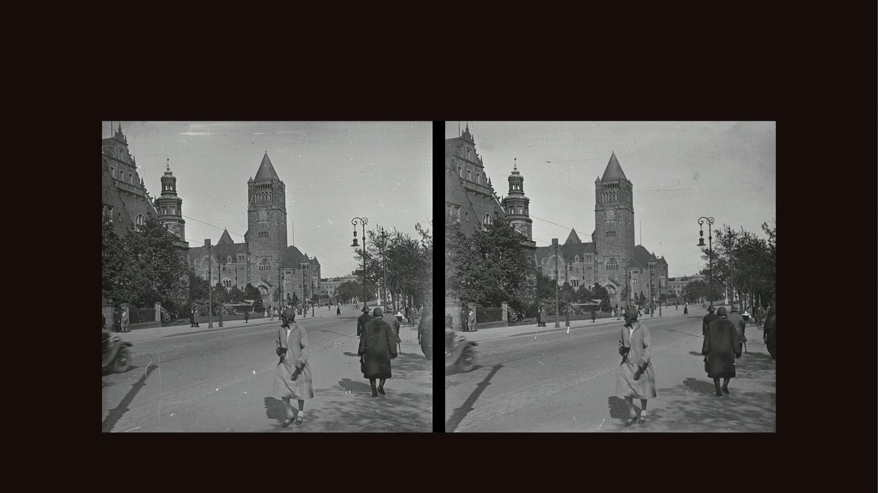 Black and white stereophotograph of the street and people walking along it. Buildings and a few trees as a background.