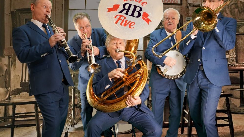 Five men dressed in blue suits play brass instruments.