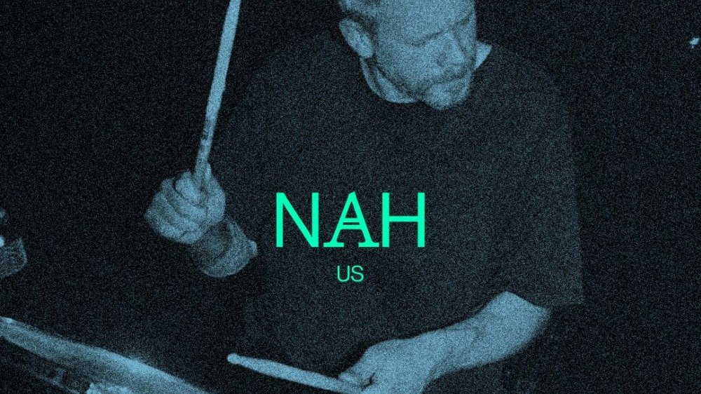 A black and blue photo of a man playing drums and a green inscription - the name of the band.