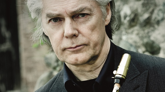 Photo of Jan Garbarek, holding a saxophone in his hands.