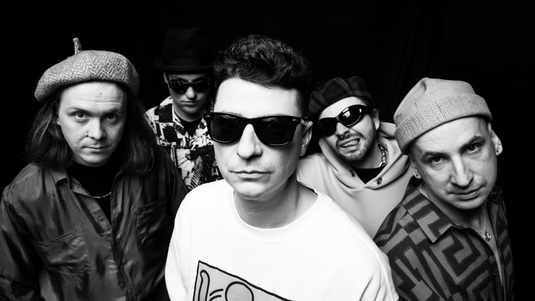 Black and white photo of five men - members of EABS band.