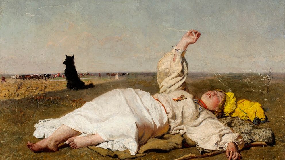 One of the pictures from the exhibition: a person in white garment lying on a ground and looking at the sky. A black dog in the background. - grafika artykułu
