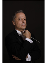 Photo of the conductor, Marco Guidarini.
