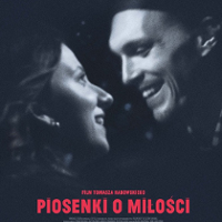 Film poster - black and white photo of a man and a woman; they look at each other and smile.