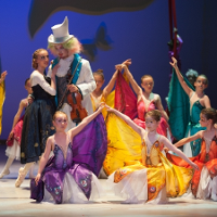 Scene from the performance: ballet dancers in colourful costumes