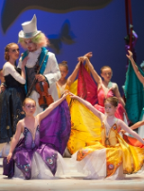 Scene from the performance: ballet dancers in colourful costumes