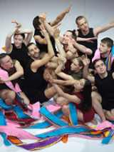 Photo from the performance: dancers close to each other in various poses.