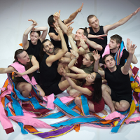 Photo from the performance: dancers close to each other in various poses.