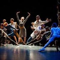 Photo from the performance - dancers in various poses on stage.