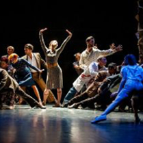 Photo from the performance: a group of dancers in various dance poses on stage.