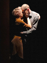 Photo from the performance: a couple in a hug