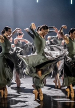 Photo from the performance: dancers in dance poses on stage.