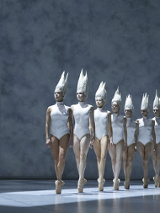 Photo frm the performance: a ballet dancers in white costumes in a row.