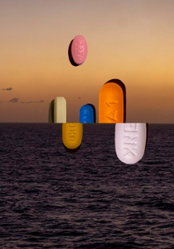 Picture of coloured pills which emerge from the sea or are under the sea's surface